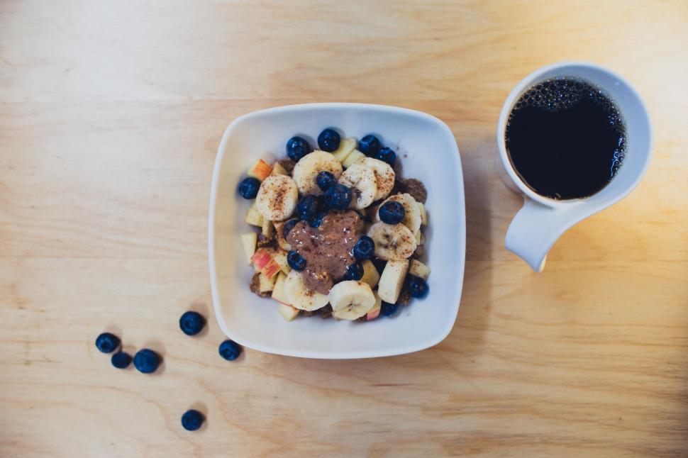 Free Image of A Bowl of Cereal and a Cup of Coffee 