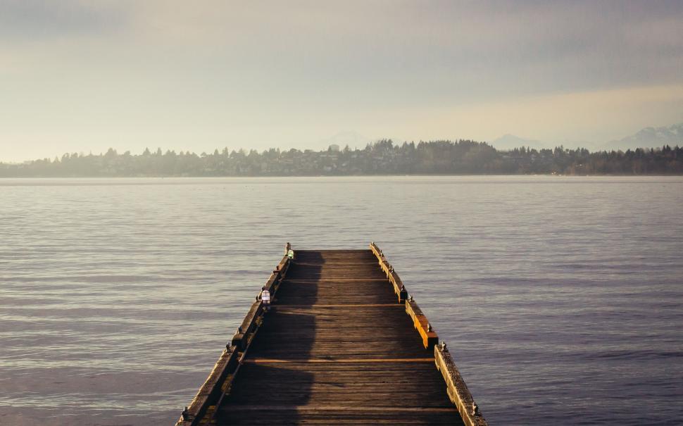 Free Image of The Long Dock Extending Into the Water 