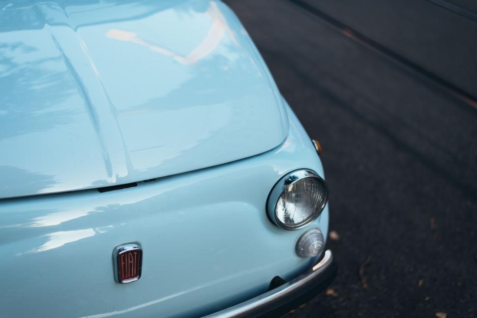 Free Image of Close Up of the Front of a Blue Car 