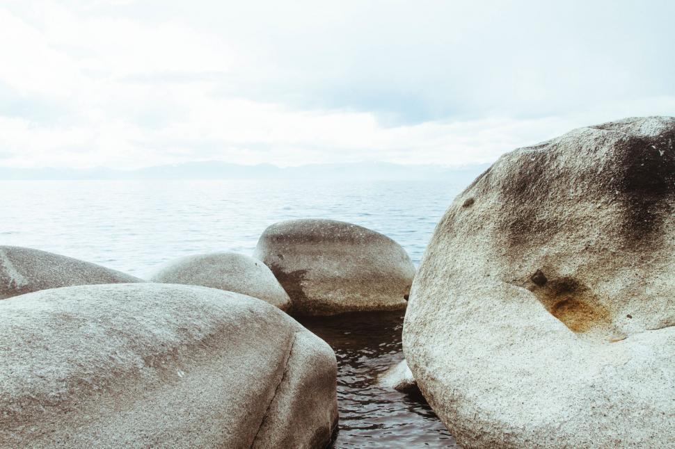 Free Image of Large Rocks Overlooking Body of Water 