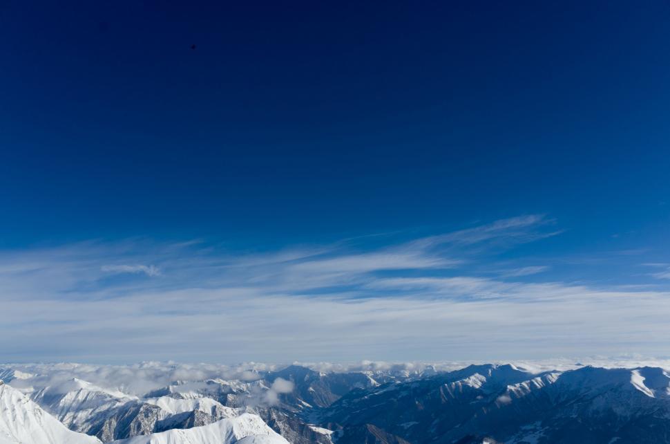 Free Image of Person Snowboarding on Mountain Top 