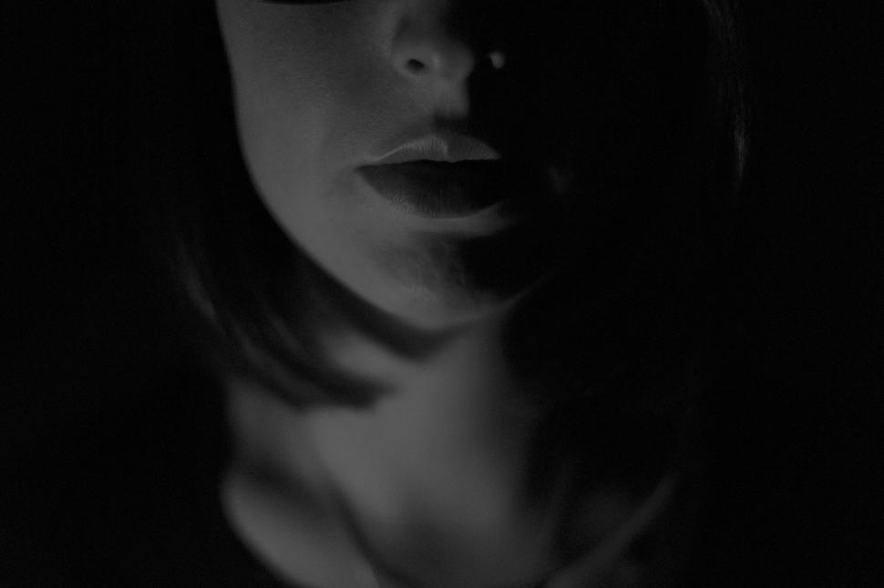 Free Image of Woman Wearing Glasses in the Dark 