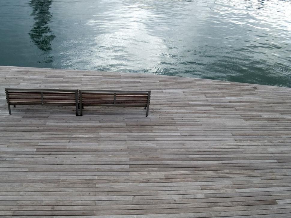 Free Image of Two Benches Resting on a Wooden Pier 