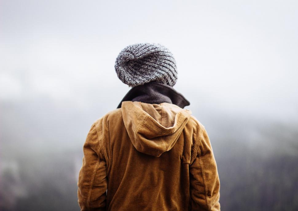 Free Image of Person Standing in Fog With Hat On 