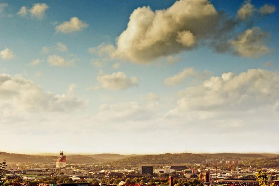 Free Image of Cityscape With Clouds Overhead 