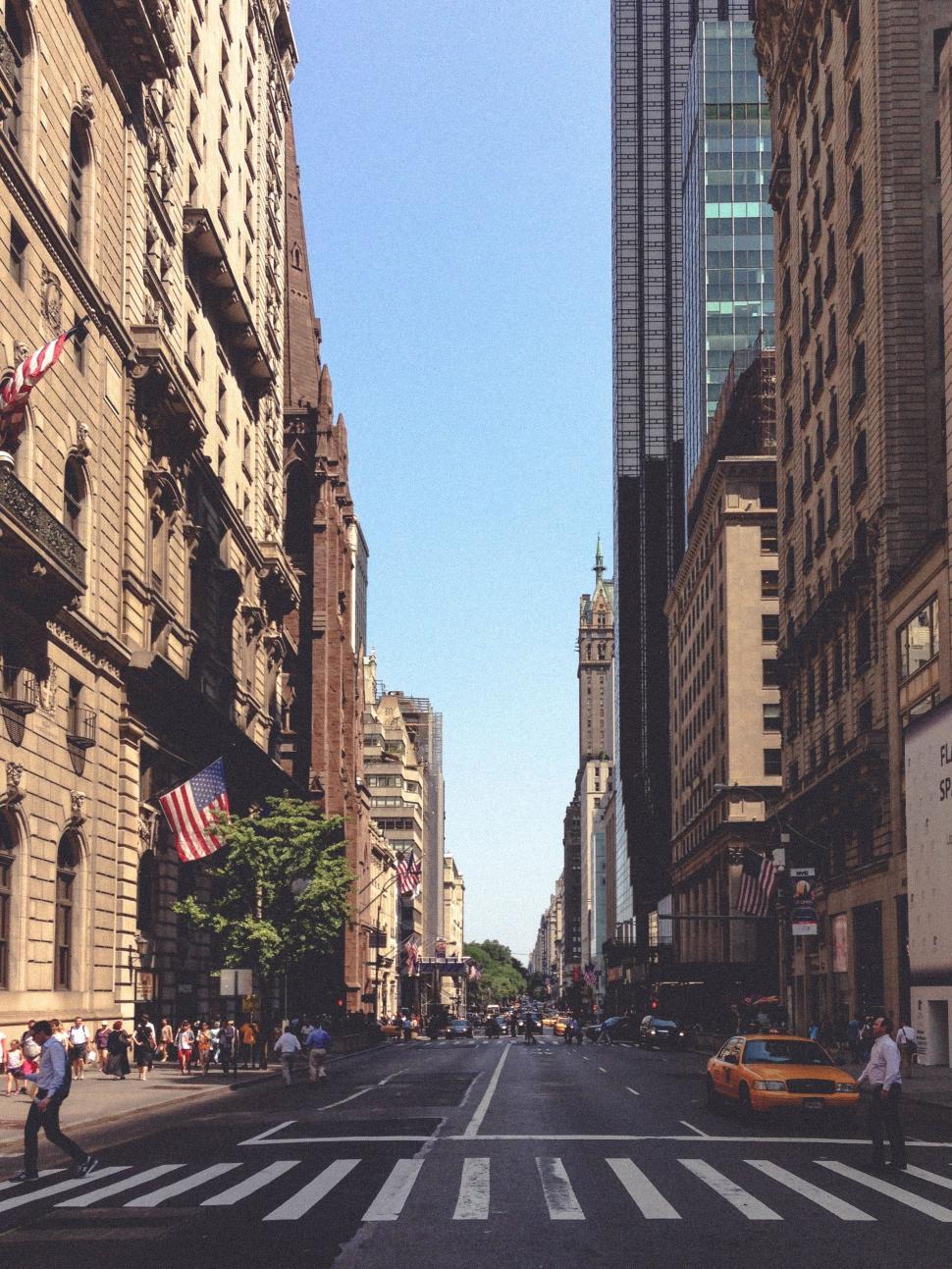 Free Image of Bustling City Street With Tall Buildings and Traffic 