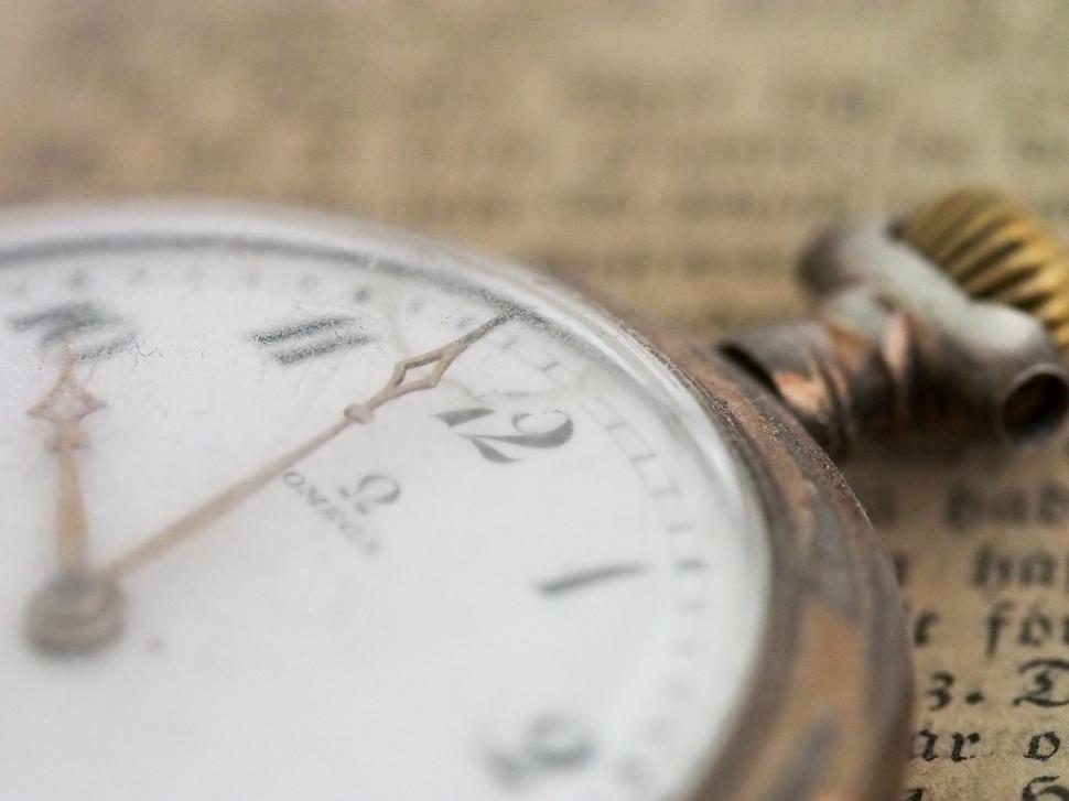 Free Image of Close Up of Pocket Watch on Piece of Paper 