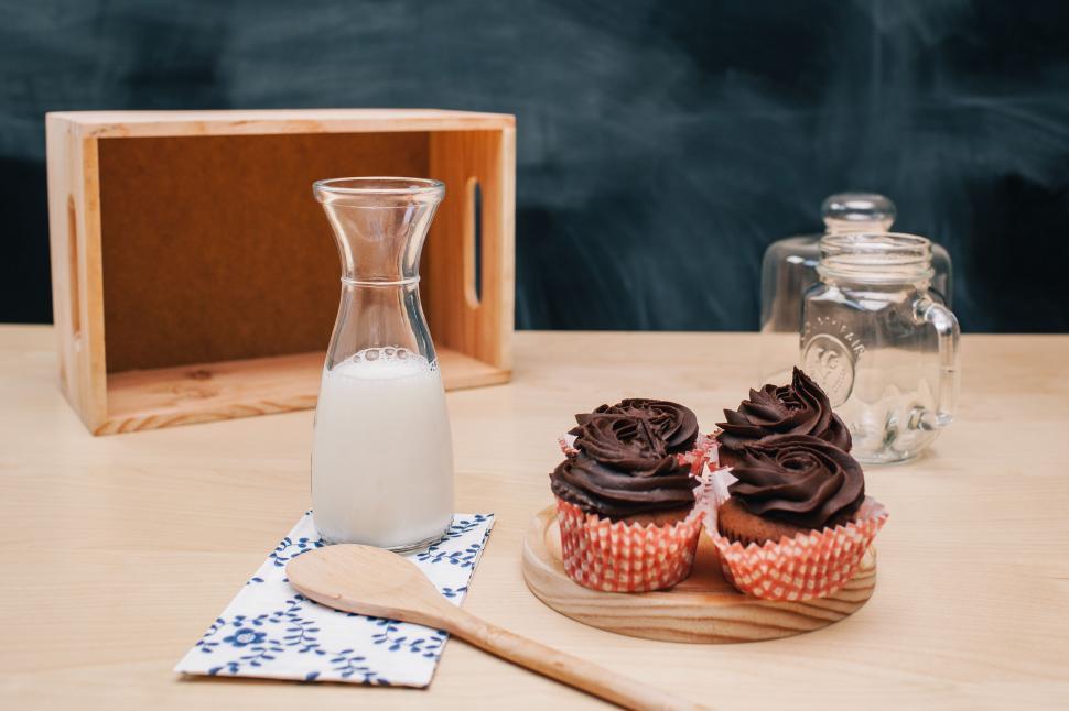 Free Image of Wooden Table With Cupcakes and Milk 