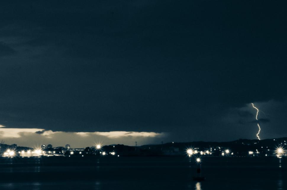 Free Image of Lightning Bolt Over City at Night 