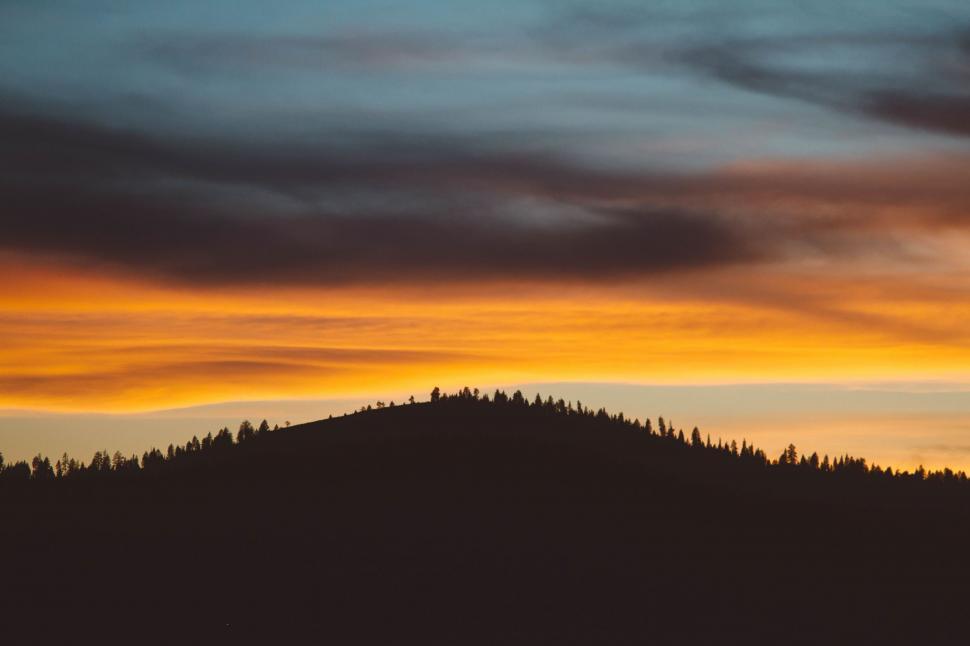 Free Image of Majestic Sunset Over Mountain Peak 