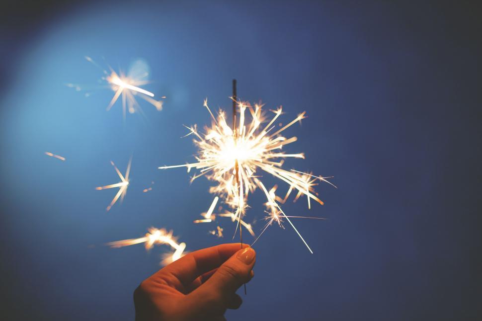 Free Image of Hand Holding Sparkler in the Air 
