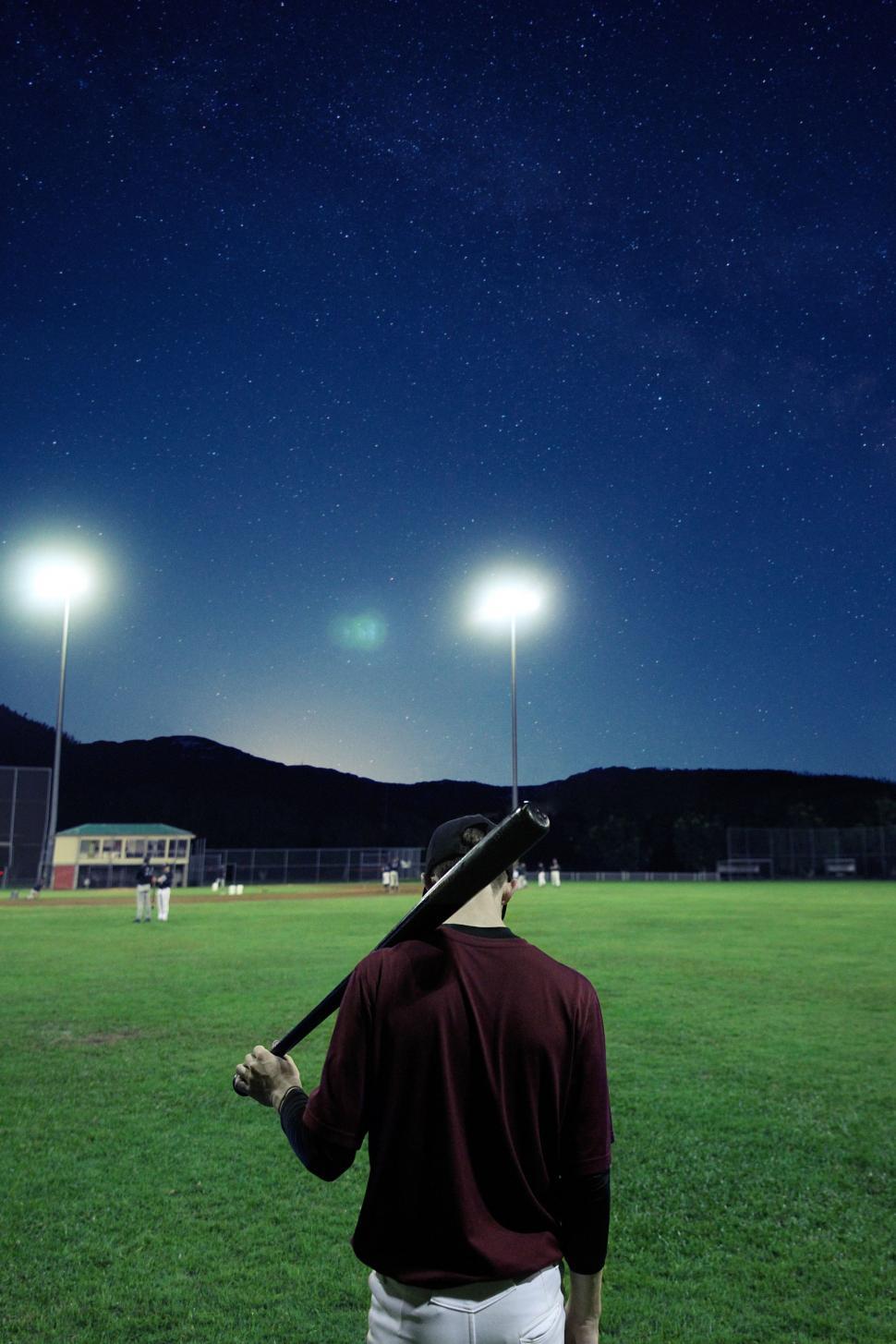 Free Image of Man Holding Baseball Bat in Field 