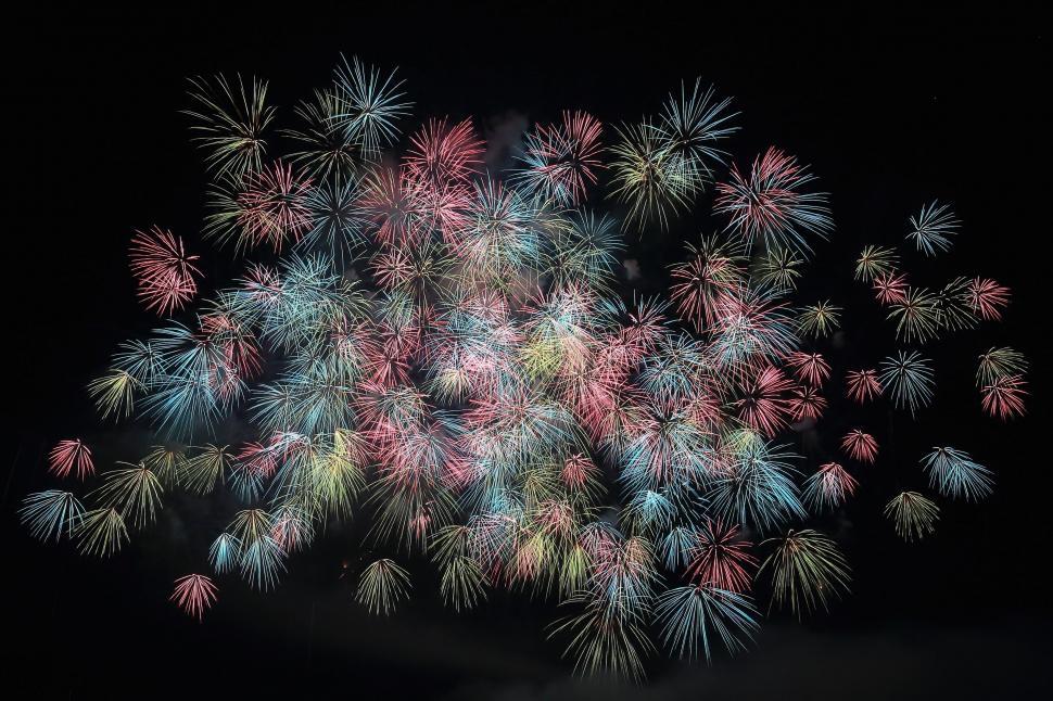 Free Image of Fiery Fireworks Illuminate the Night Sky 