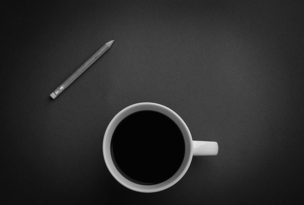 Free Image of A Cup of Coffee and a Pencil on a Table 