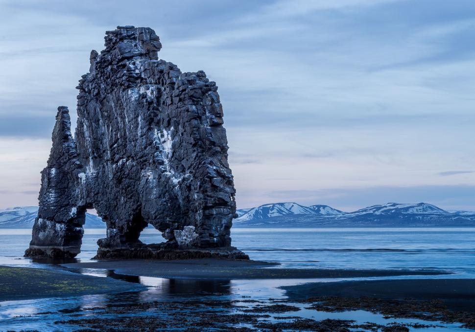 Free Image of Majestic Rock Formation Overlooking Beach 