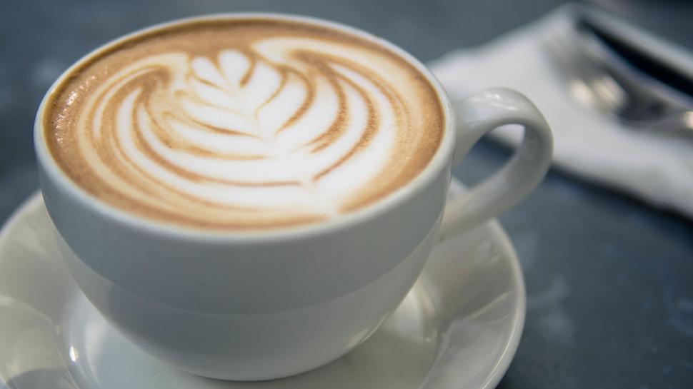Free Image of A Cup of Cappuccino on a Saucer 