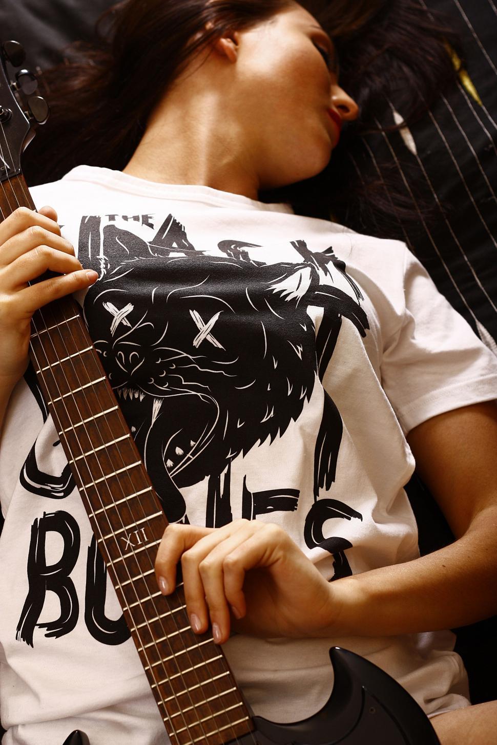 Free Image of Person Holding Guitar 