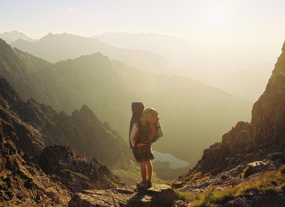 Free Image of Man Hiking Up a Mountain With Backpack 
