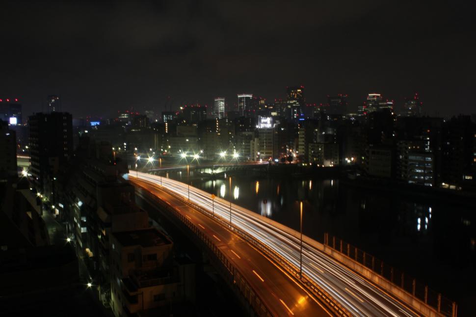 Free Image of Night Time View of Highway and City 