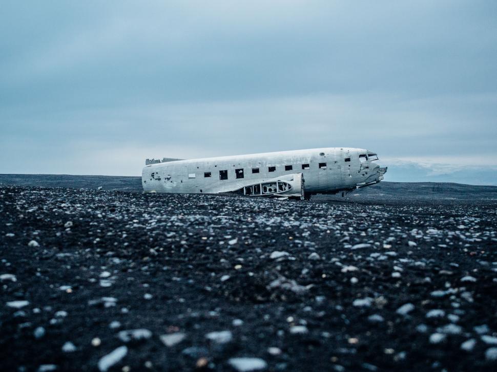 Free Image of Plane Parked on Snow-Covered Field 
