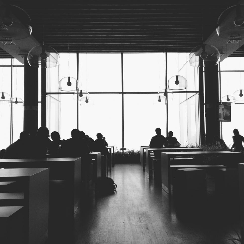 Free Image of People Sitting at Tables in Black and White 