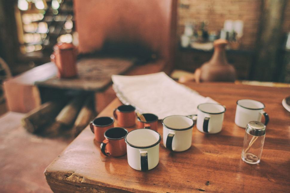 Free Image of Wooden Table With Cups and Saucers 