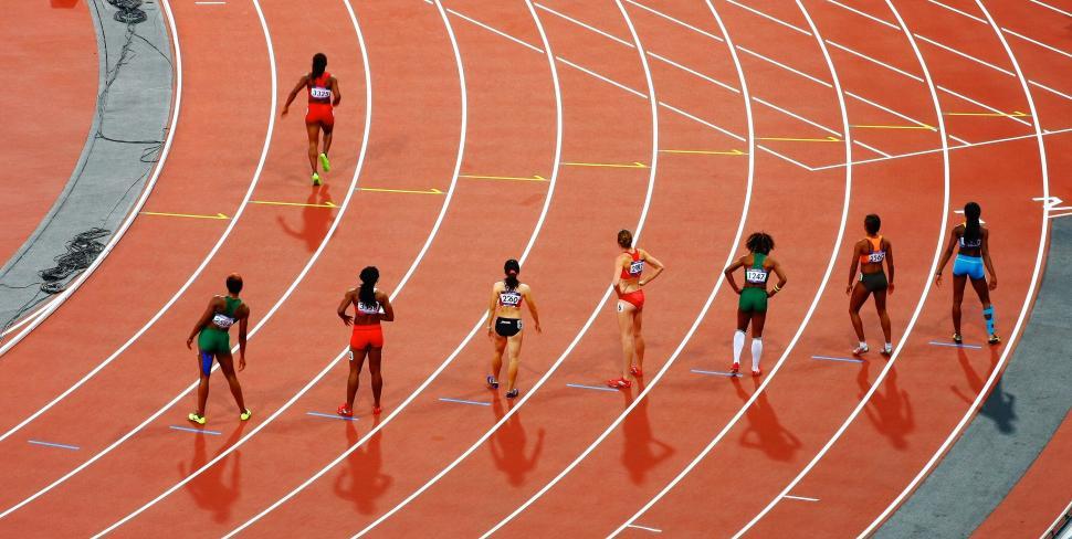 Free Image of Group of Women Running on a Track 
