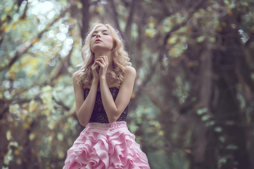 Free Image of Woman in Pink Dress Standing in Forest 