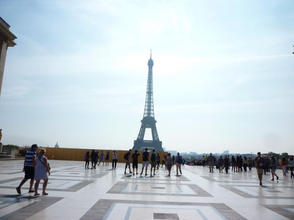 Free Image of Group of People Standing in Front of the Eiffel Tower 
