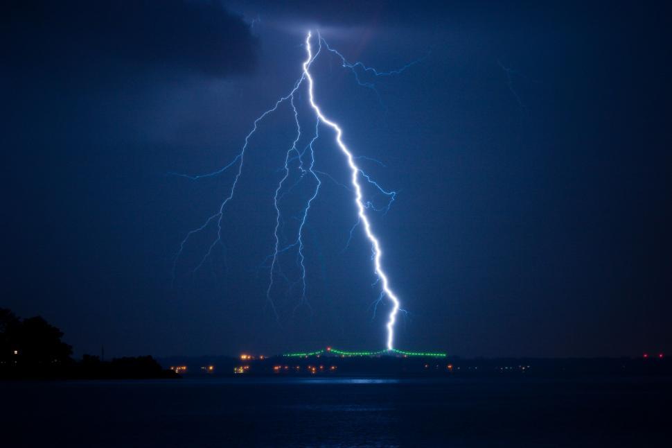 Free Image of Lightning Bolt Striking Ocean at Night 