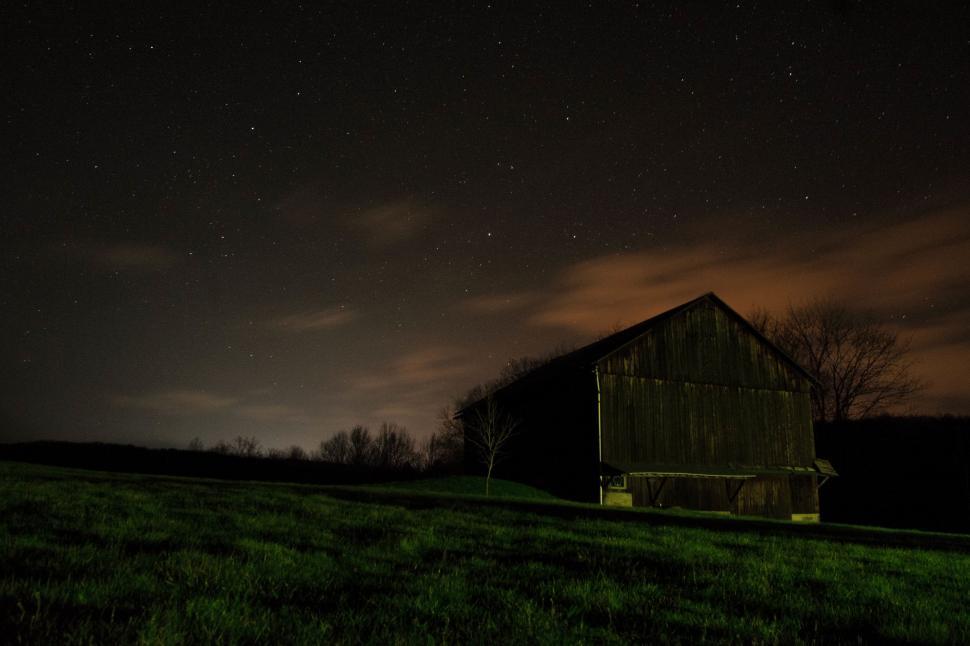 Free Image of Barn in a Field at Night 
