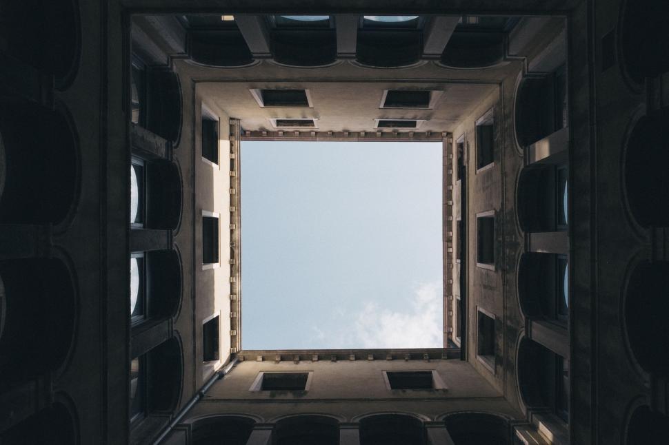 Free Image of View From the Bottom of a Building Looking Up Into the Sky 