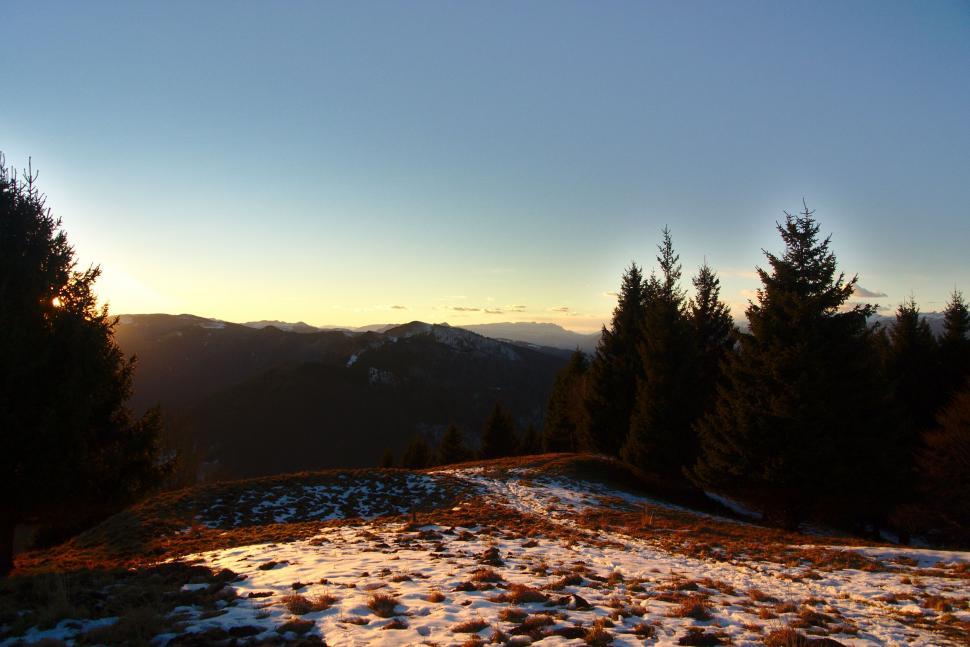 Free Image of Sun Setting on Snowy Mountain 