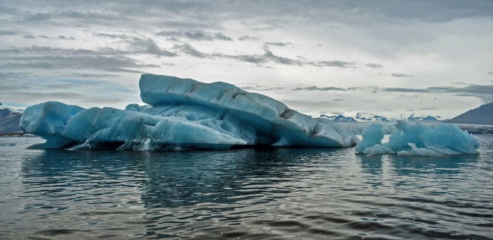 Free Image of Massive Iceberg Floating on Body of Water 