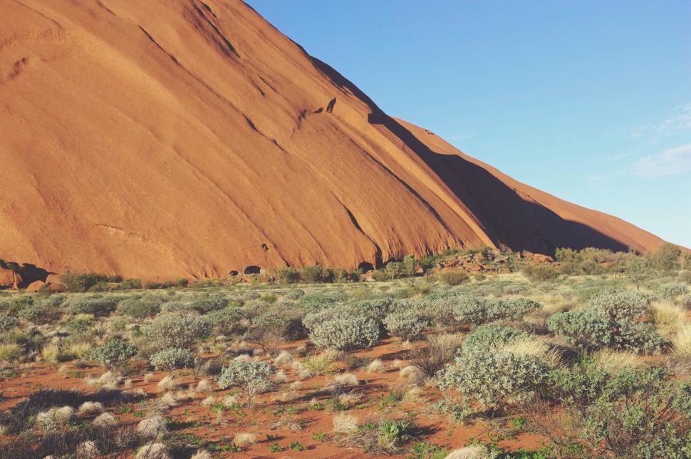 Free Image of Massive Rock Formation in Arid Desert Landscape 