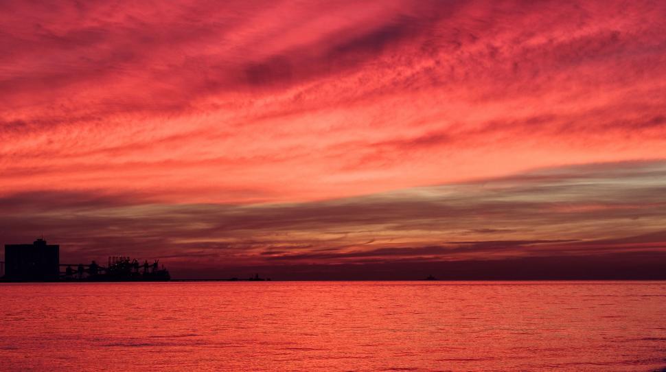 Free Image of Red Sky Over Body of Water 