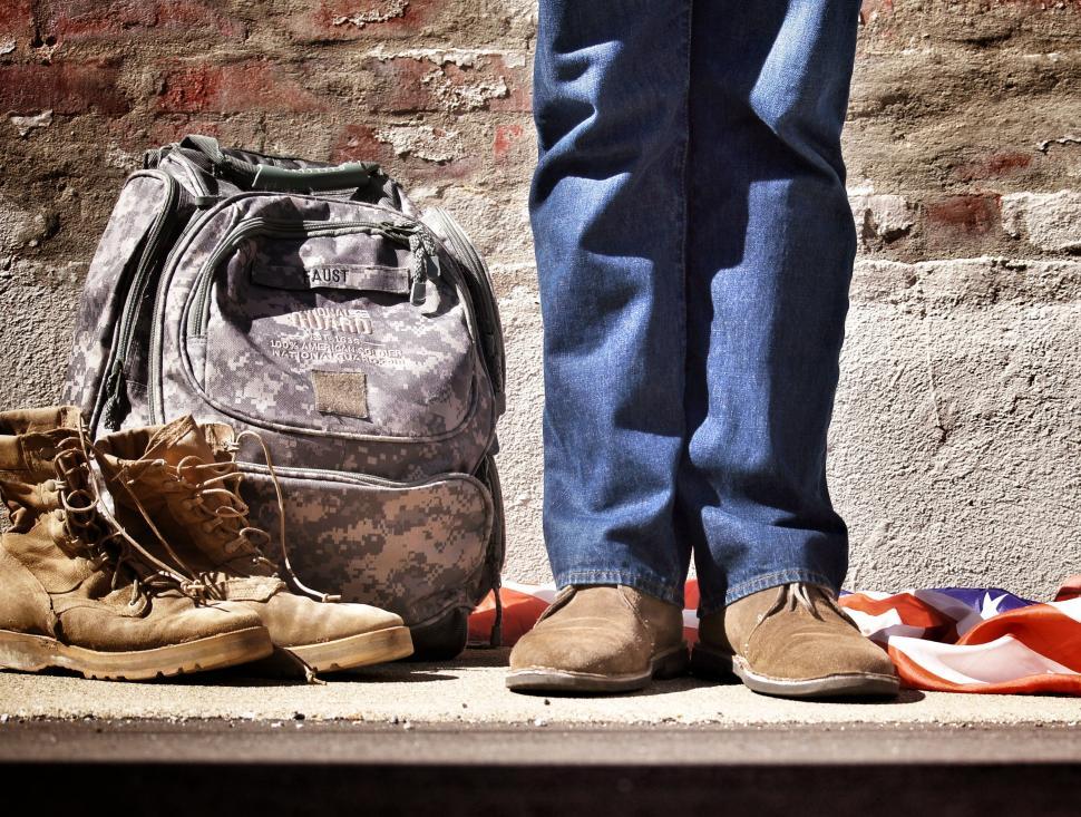 Free Image of Person Standing With Backpack and Shoes 