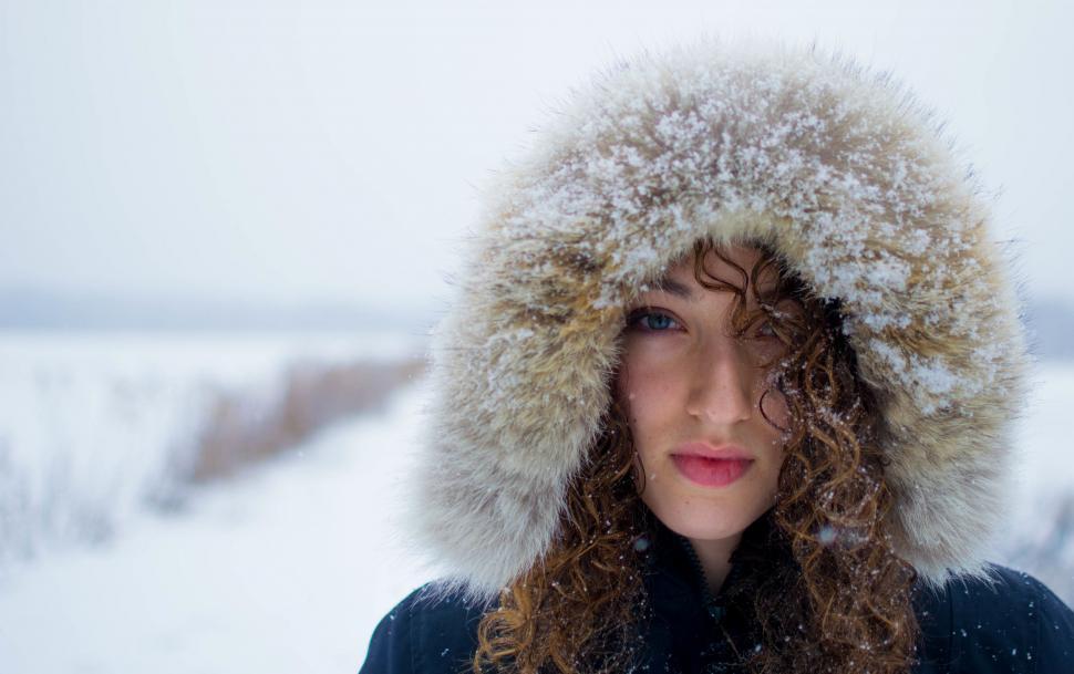 Free Image of Woman Wearing Fur Hat in Snow 