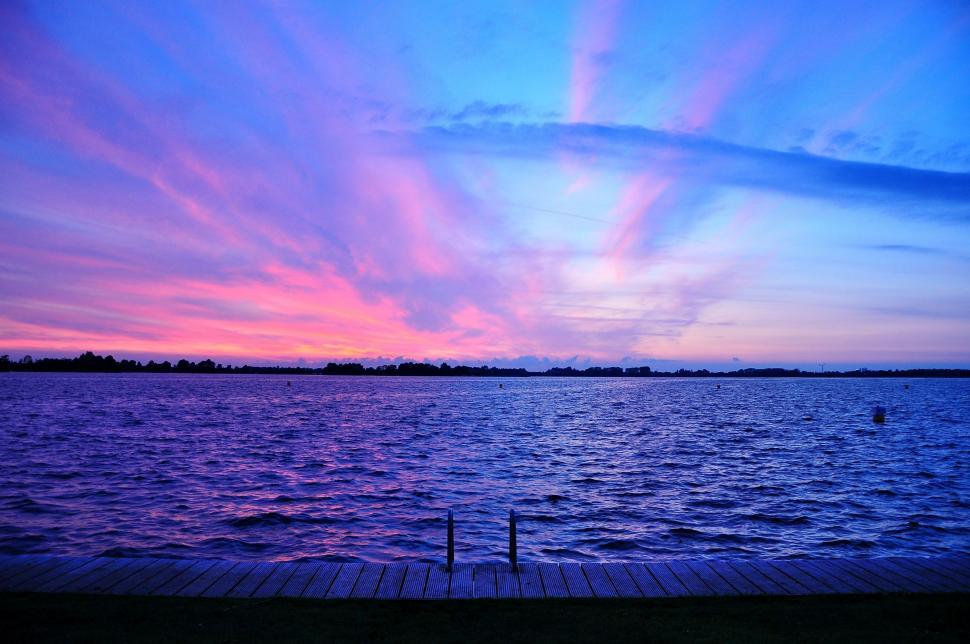 Free Image of Sunset Over a Body of Water With Dock 