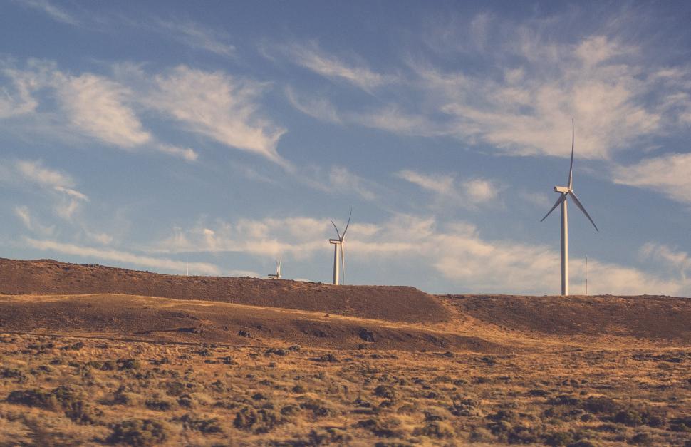 Free Image of Group of Windmills on Hill Under Blue Sky 