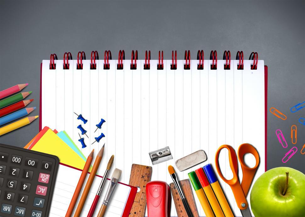 Free Image of School supplies on notebook - Study and learning concept 
