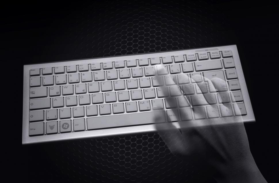 Free Image of Hacking concept - Transparent hands over computer keyboard 
