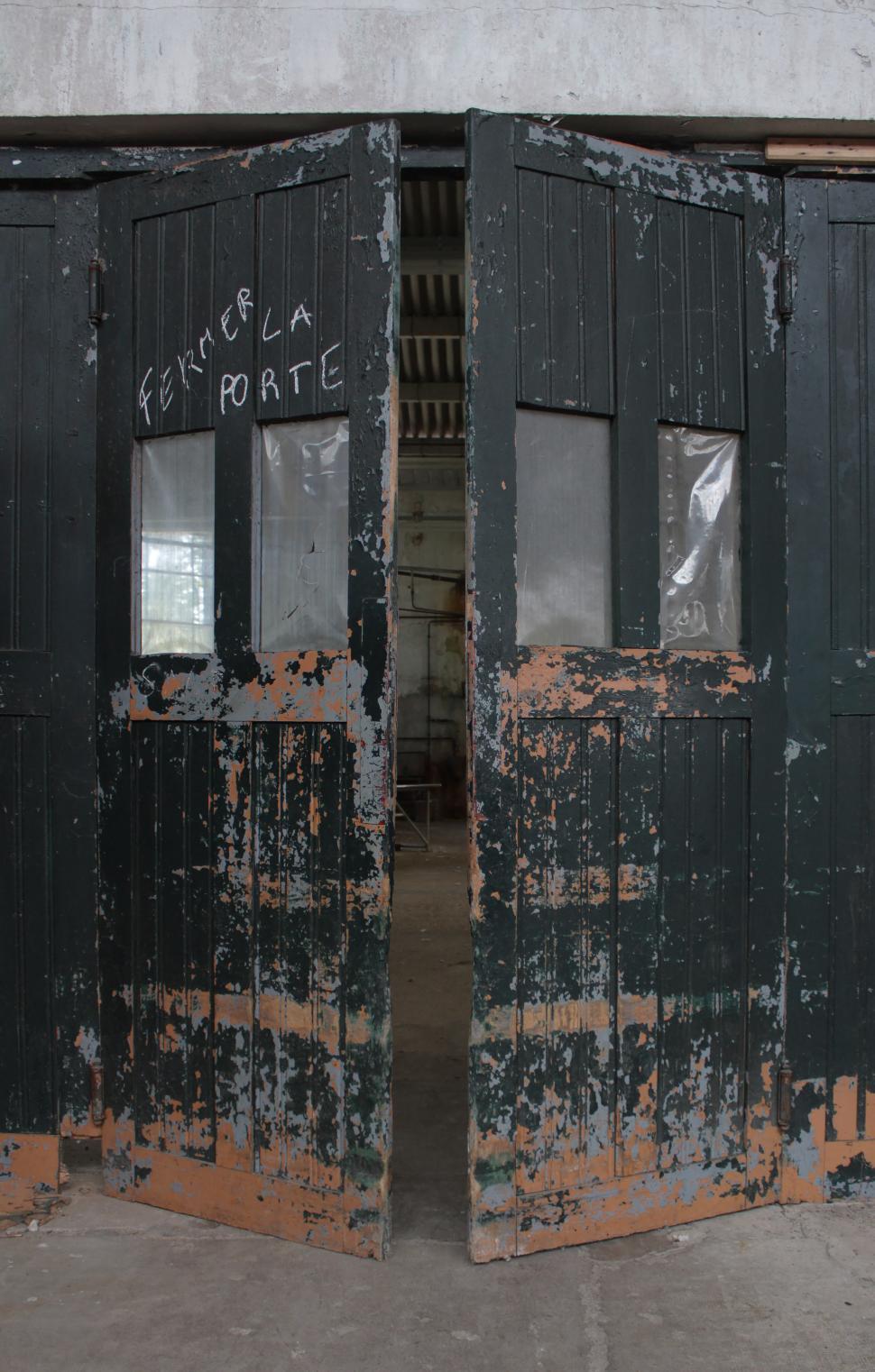 Free Image of Two Black Doors Inside Building 