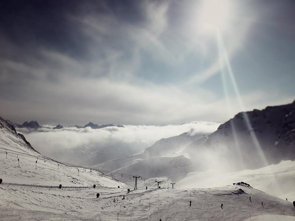 Free Image of Group of People Skiing Down Snow-Covered Slope 