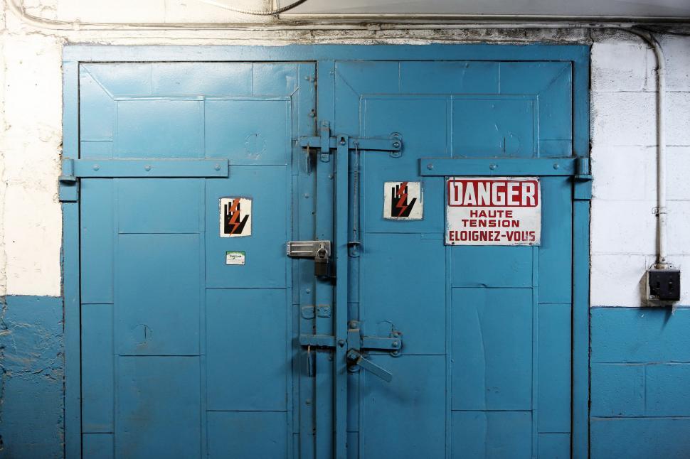 Free Image of Two Blue Doors With Signs 
