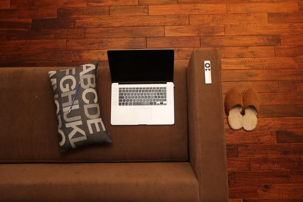 Free Image of Laptop Computer on Brown Couch 
