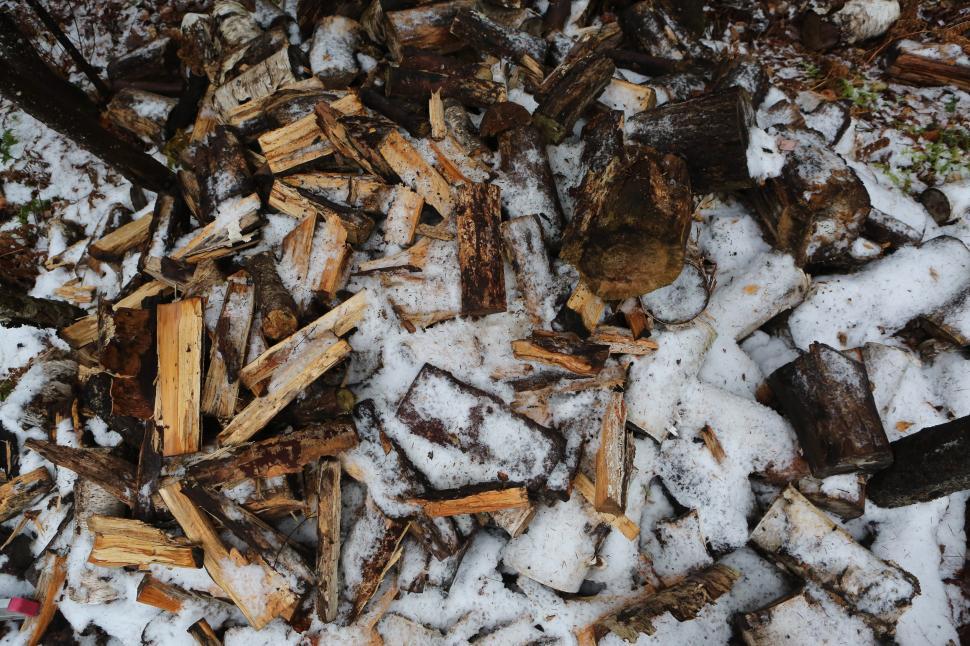 Free Image of Snow-Covered Pile of Wood 