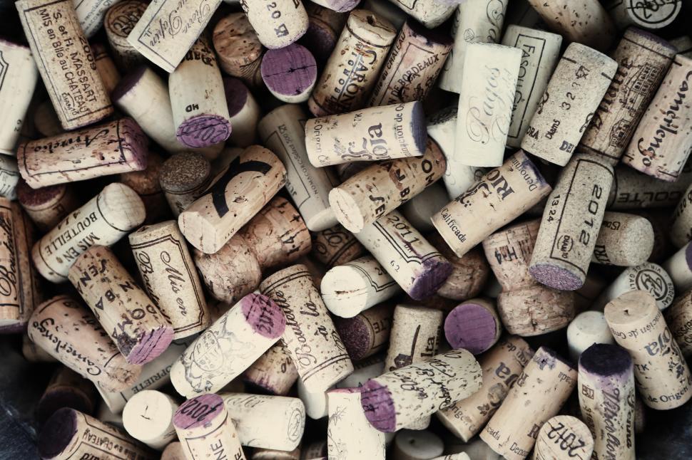 Free Image of Stack of Wine Corks With Writing 