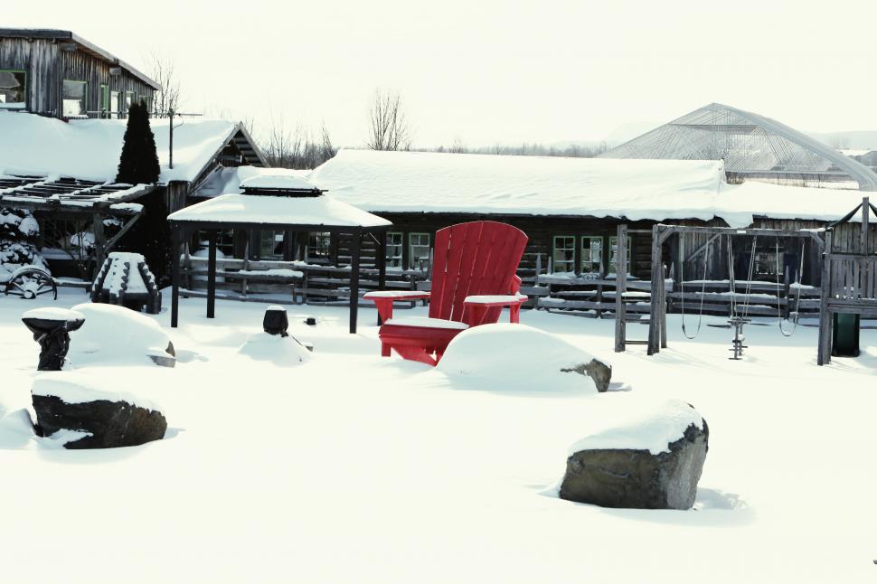 Free Image of Red Chair in Snow Covered Yard 