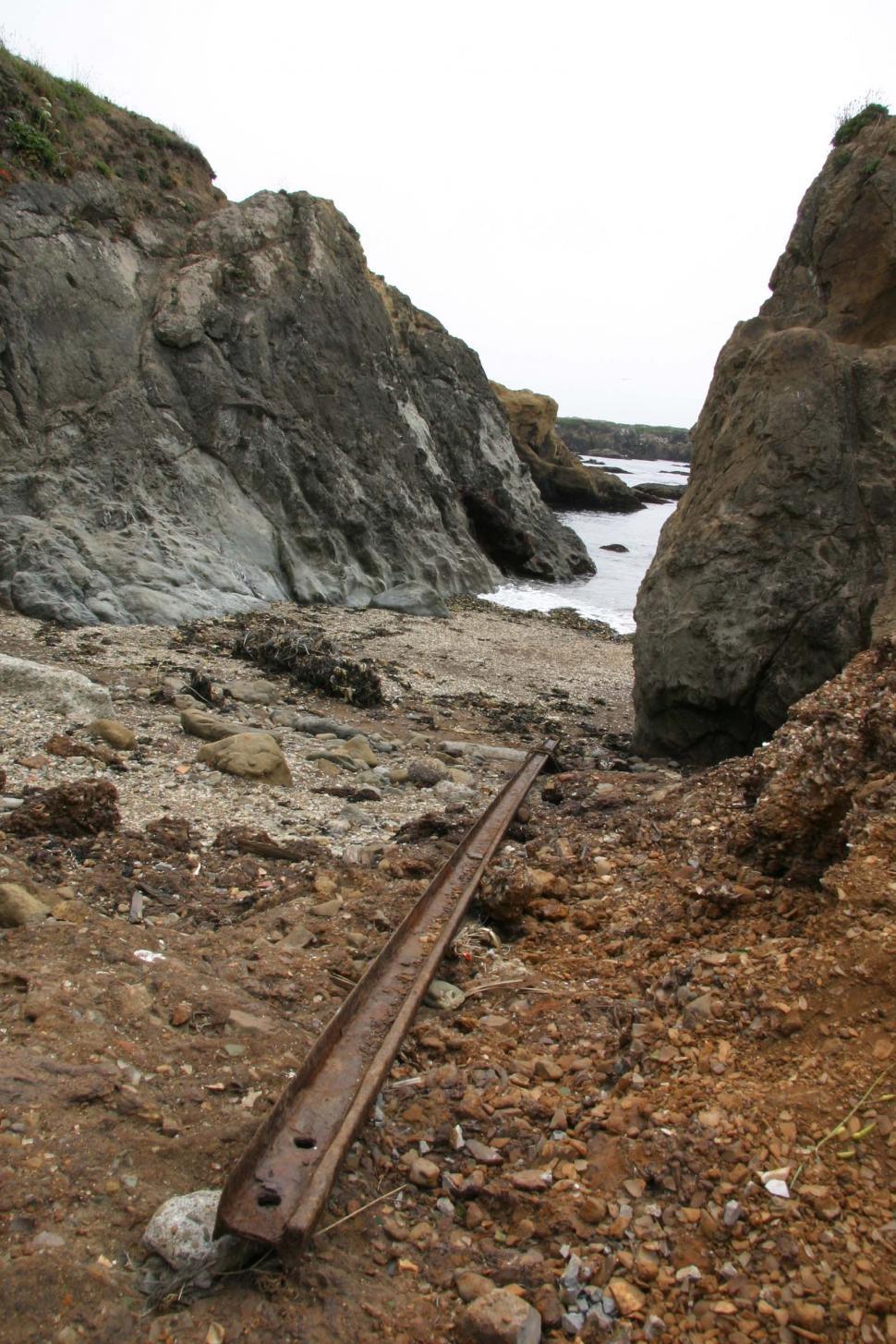 Free Image of beach fort bragg california rocky shore ocean sand wave rocks sea shoreline coast coastal pacific glass rail train track trash garbage landfill dirt 